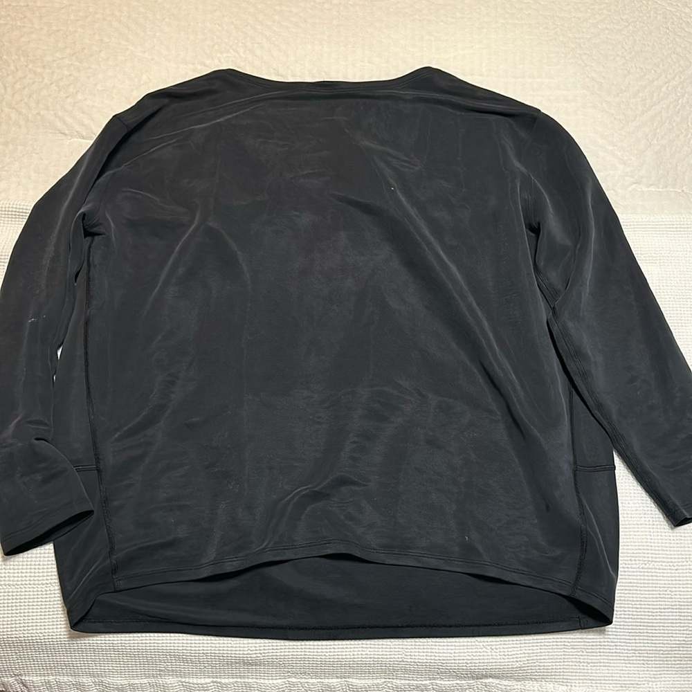 Black Lululemon Back in Action suede 3/4 length shirt.